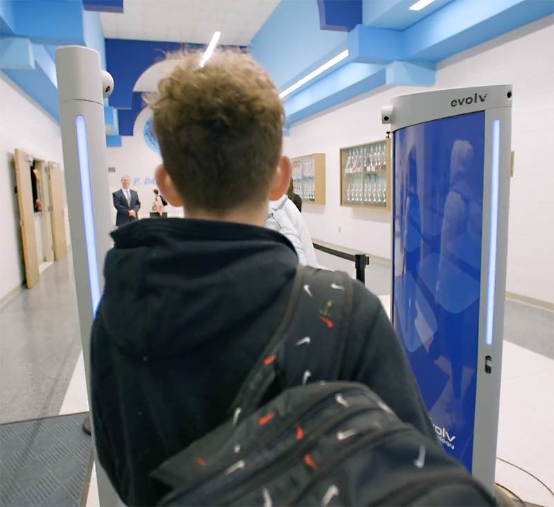 Student walking through an Evolv Weapons Detection System at School